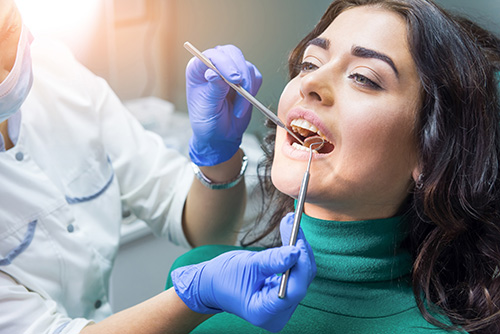 emergency dental services woman receiving emergency dental services tx