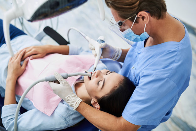dental health services woman receiving Dental Health Services in texas