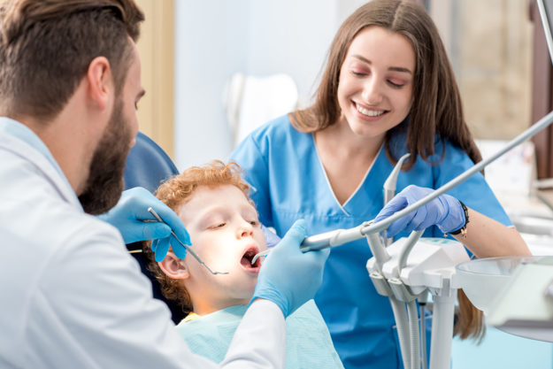 when should a child go to the dentist child at the family dentist after mom asked When Should a Child Go to the Dentist