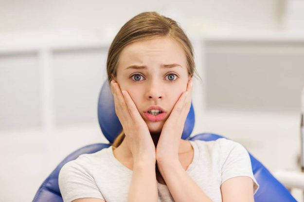 dental anxiety (2) woman is suffering from dental anxiety.