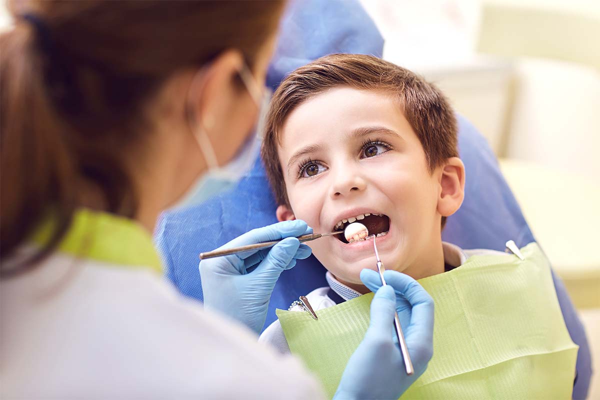 kid getting treatment at childrens dentist