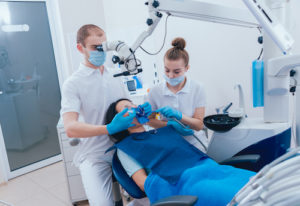 Doctor and Nurse prepare a patient for a tooth extraction