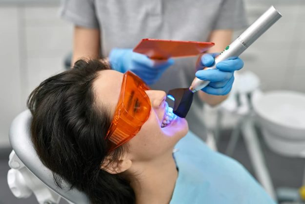 whitening woman receives professional whitening