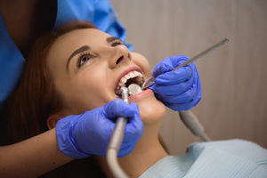 woman gets a dental exam 