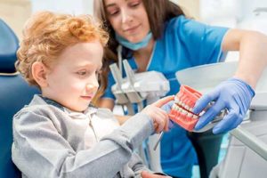 child participates in pediatric dentistry 